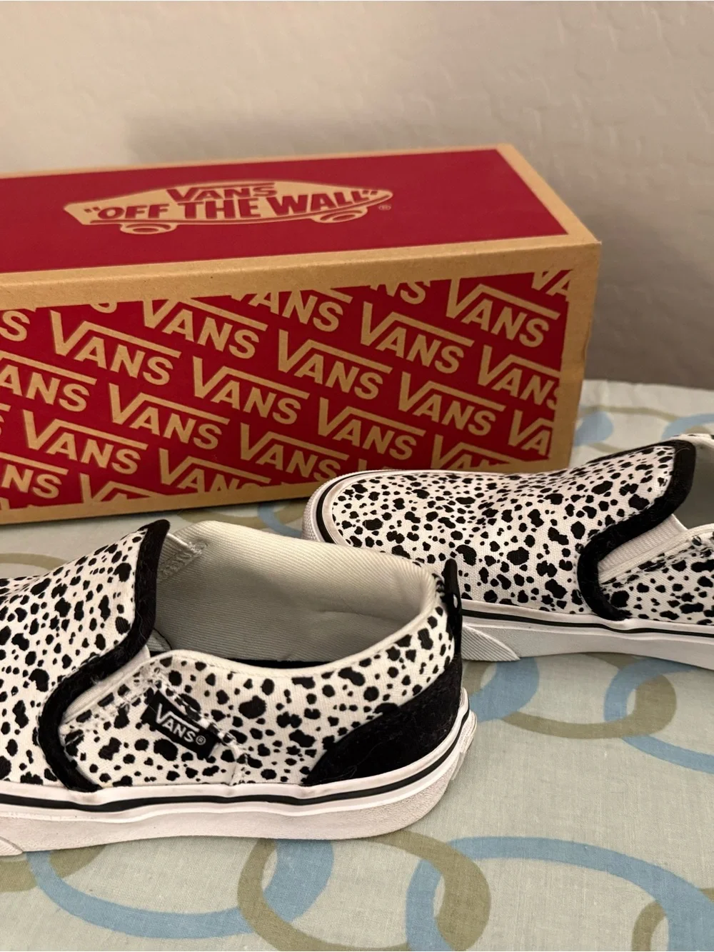 Vans Kids Slip-On Sneakers in White with Black Spot Print